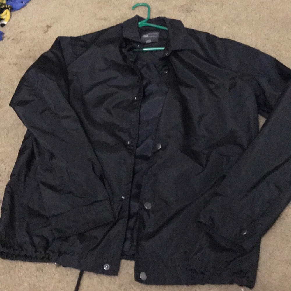 black hoodless windbreaker